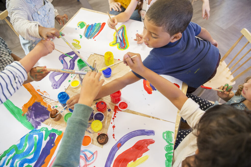 Children painting in art therapy