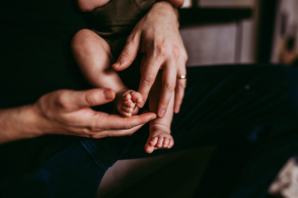 Parents holding a newborn baby